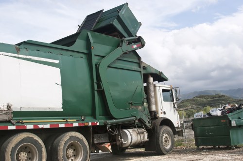 Waste removal trucks in West End